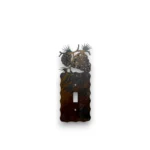 metal light switch cover with pine cone