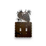 pine cones on a metal double switch cover