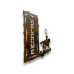 Side view of hand-painted 3D metal welcome wall art with roping cowboy on horseback, rustic welcome sign, yucca flowers, and western ranch design.