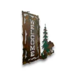 Side view of a hand-painted 3D metal welcome wall art with grizzly bear, evergreen tree, rustic welcome sign, and mountain cabin decor style.