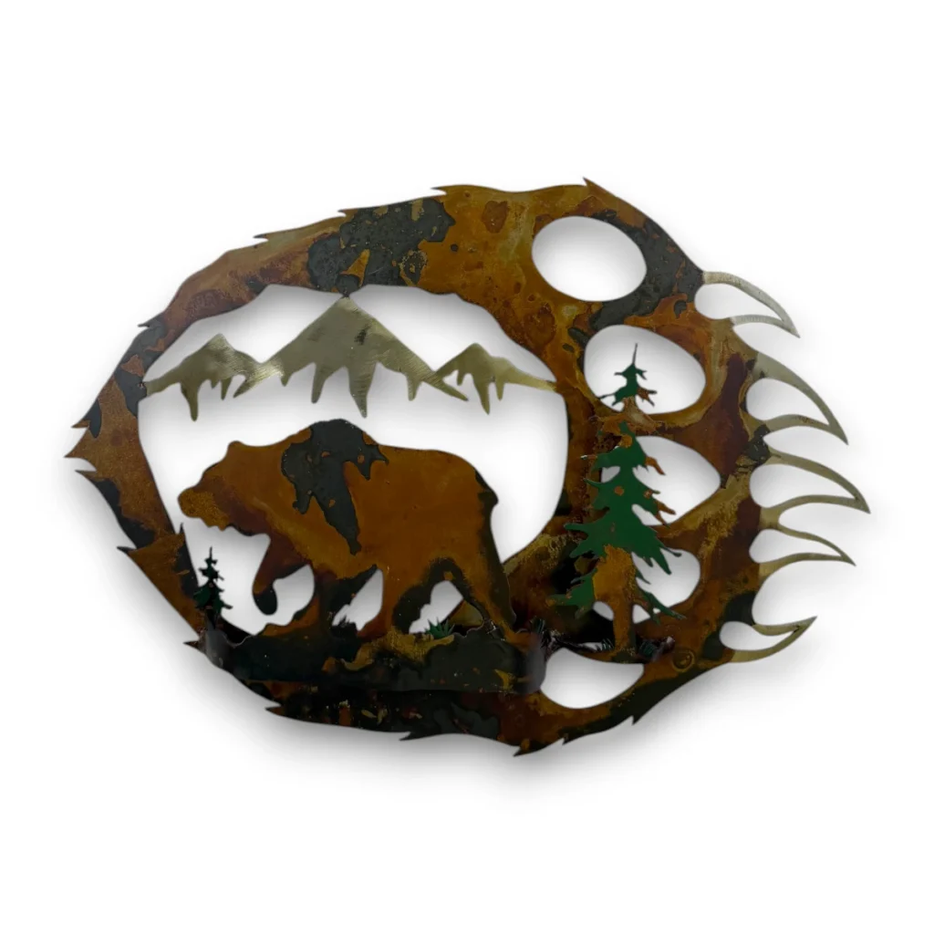 Hand-painted 18 inch 3D metal bear paw wall art with grizzly bear, mountain peaks, evergreen trees, and rustic cabin wildlife decor.
