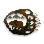 Hand-painted 18 inch 3D metal bear paw wall art with grizzly bear, mountain peaks, evergreen trees, and rustic cabin wildlife decor.