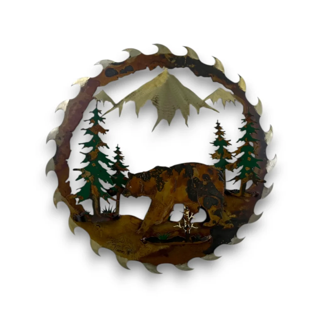 Hand-painted 18 inch 3D metal saw blade wall art with black bear, mountain peaks, evergreen trees, and rustic cabin wildlife decor.