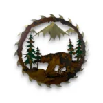 Hand-painted 18 inch 3D metal saw blade wall art with black bear, mountain peaks, evergreen trees, and rustic cabin wildlife decor.