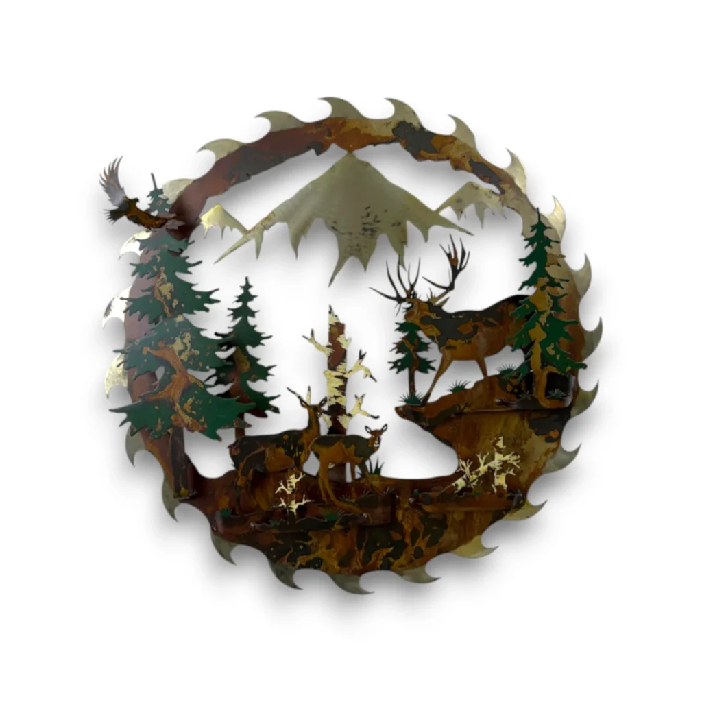 Hand-painted 24 inch 3D metal saw blade wall art with mule deer family, mountain peaks, evergreen trees, and rustic cabin wildlife decor.