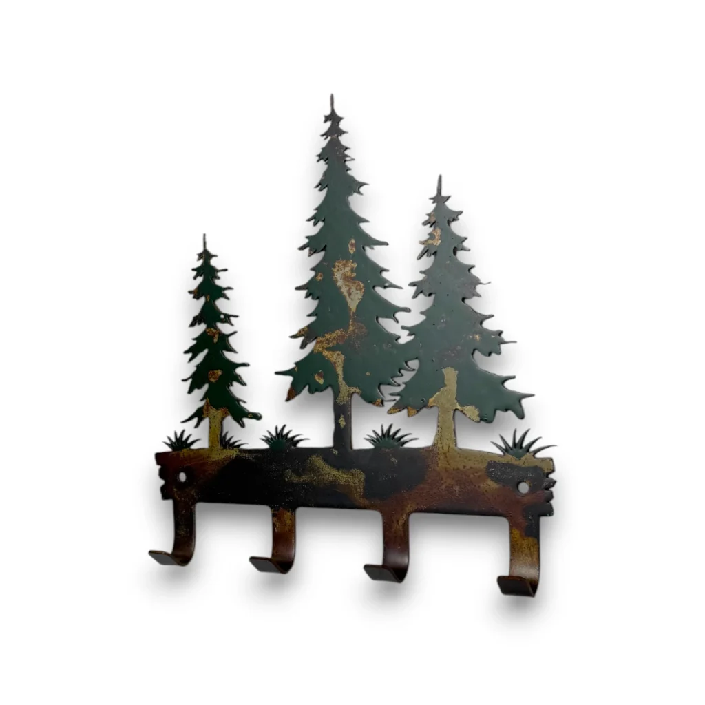 Hand-painted pine tree metal key holder with four hooks, rustic weathered finish, and woodland cabin decor style.