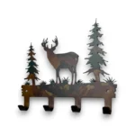 Hand-painted whitetail deer metal key holder with pine trees, four hooks, rustic weathered finish, and cabin wildlife decor style.