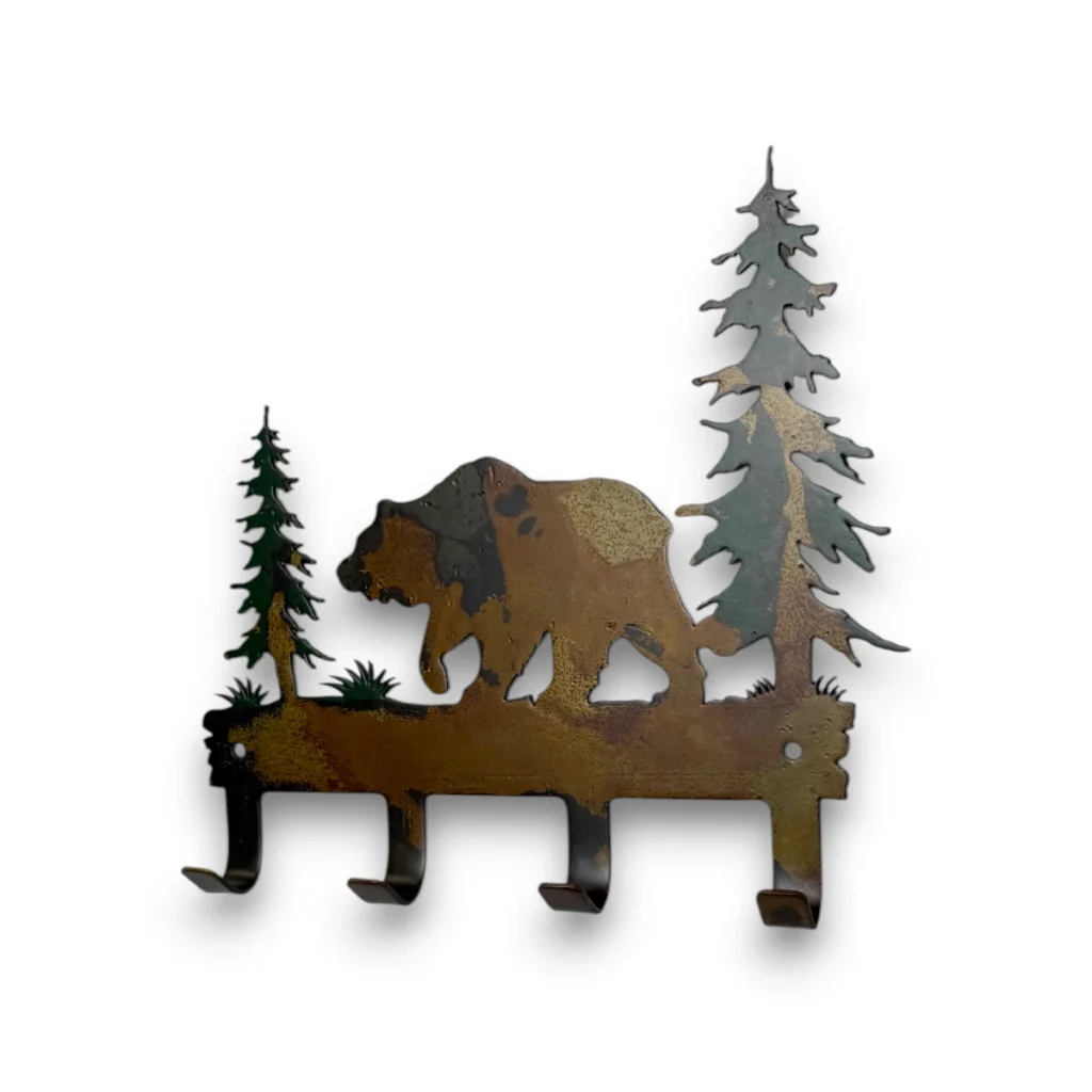 Hand-painted grizzly bear metal key holder with pine trees, four hooks, rustic weathered finish, and cabin wildlife decor style.