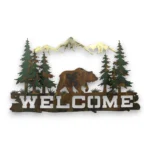 Hand-painted grizzly bear welcome metal wall art with pine trees, mountains, rustic weathered finish, and cabin lodge decor style.