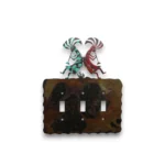 Hand-painted triple toggle metal light switch cover with turquoise Kokopelli figures and rustic Southwestern decor style.